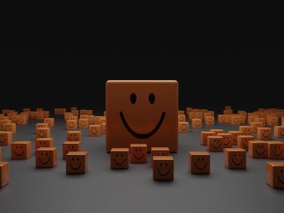 plusieurs blocs de bois avec des smileys gravés